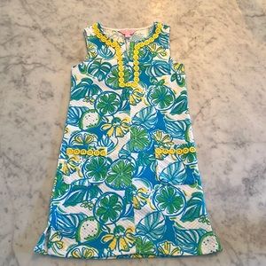 Kids ivory chef, dress with yellow and green tropical pattern.